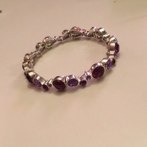 purple jeweled bracelet.
